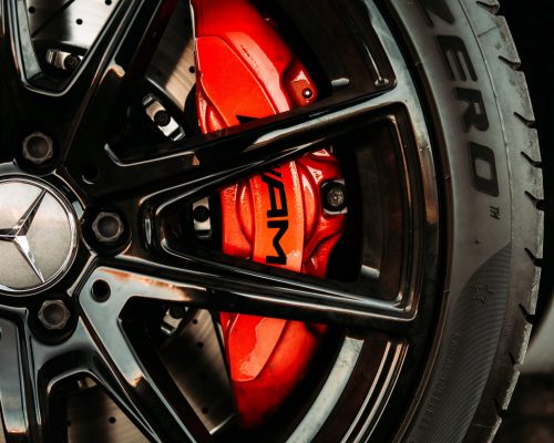 mercedes benz tire with red brakes and black rimes taken by jakob rosen